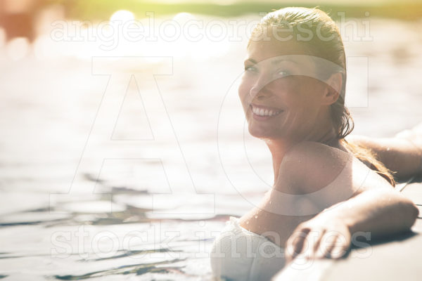 Enjoy The Summer Woman Relaxing In The Pool Water