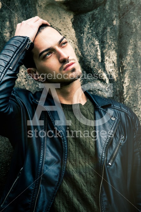 Beautiful Young Trendy Man With Hand On Head. A Cool Guy Posing Angelo Cordeschi