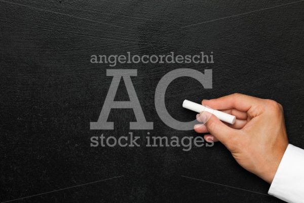 Black wall. Empty blackboard or chalkboard hand with white chalk - Angelo Cordeschi