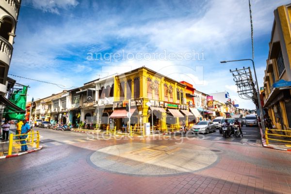 Crossroad In Phuket City Center In Thailand With Colorful Buildi Angelo Cordeschi