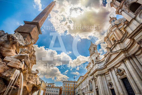 Fountain of rivers in Rome in Italy. In the background, the baroque church of Santa Agnese in Agone. - Angelo Cordeschi