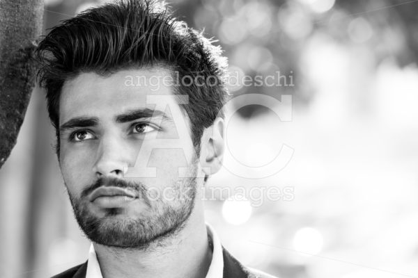 Handsome man, close portrait of young man with stubble beard. - Angelo Cordeschi