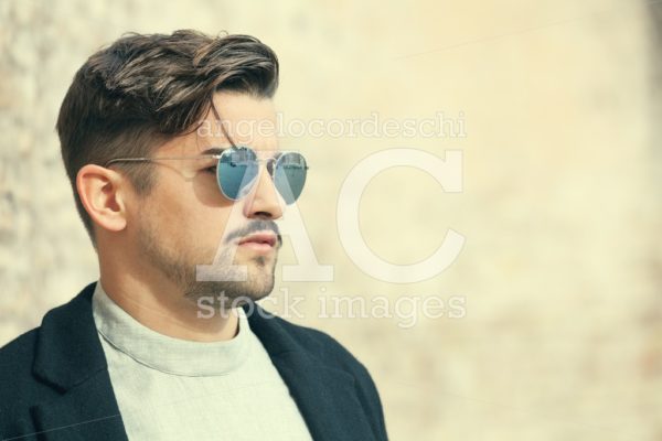 Handsome Stylish Man With Sunglasses And Modern Hairstyle And Be Angelo Cordeschi