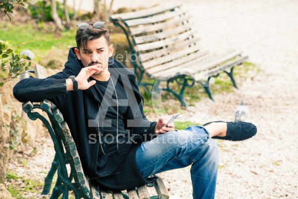 Handsome Young Man Model Sitting On The Bench. A Handsome Young Angelo Cordeschi