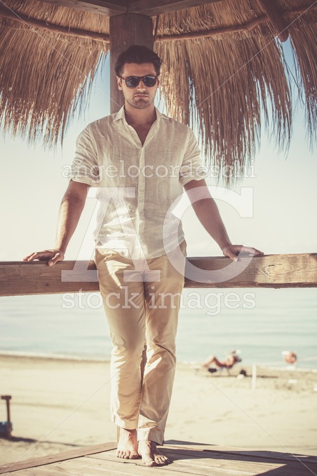 Handsome Young Man With White Shirt And Sunglasses Relaxed Leani Angelo Cordeschi
