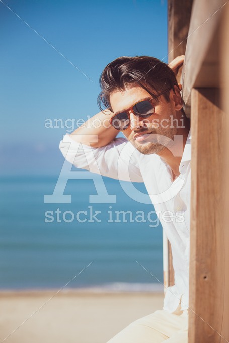 Man With White Shirt And Sunglasses On The Beach Vacation Lookin Angelo Cordeschi