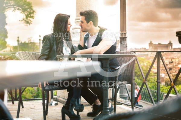 Pair of lovers seated at the restaurant. Couple in love. On vaca - Angelo Cordeschi