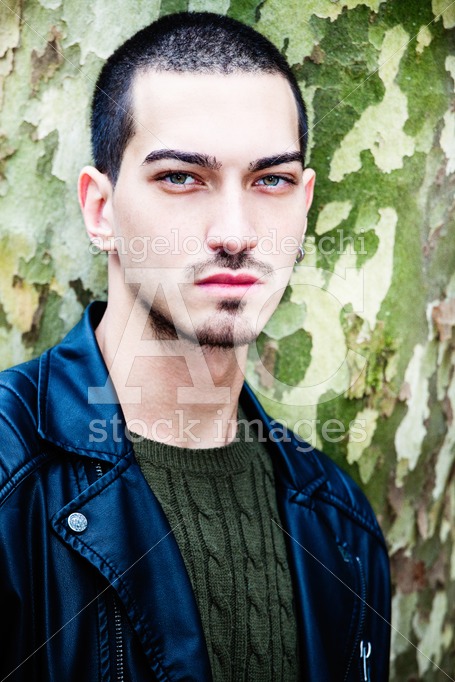 Portrait Of A Young Handsome Man Near A Tree. Tree With Camoufla Angelo Cordeschi