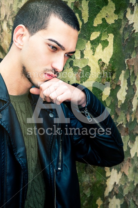 Portrait Of Thinking Young Man. A Guy With A Leather Jacket With Angelo Cordeschi