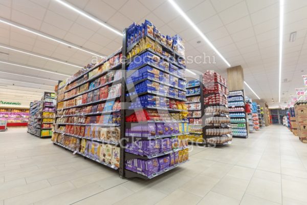 Shelves Of Products For Sale Inside A Supermarket Shopping Mall Angelo Cordeschi