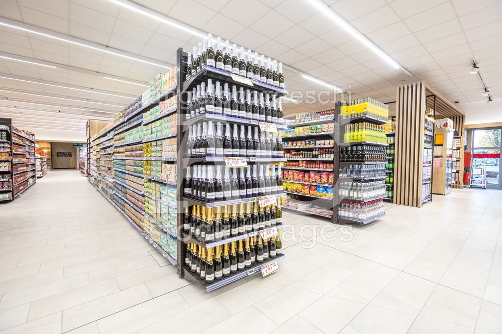 Shelves of products for sale inside a supermarket shopping mall