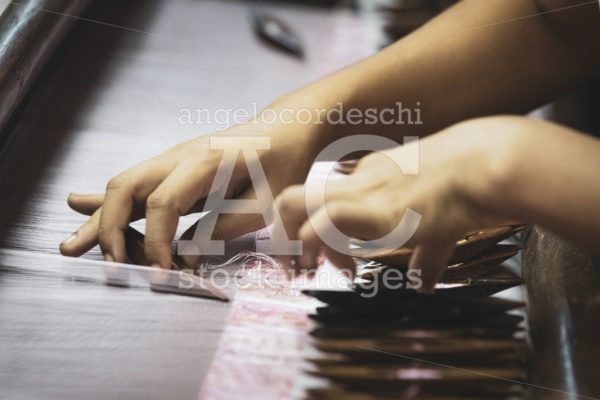 Woman's Hands Details In An Ancient Textile Processing. Silk Loo Angelo Cordeschi