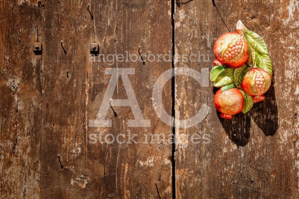 Wooden Background With Decoration Pomegranate. Angelo Cordeschi