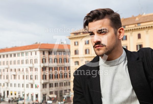 Young And Handsome Man Portrait. In The Street In The City Durin Angelo Cordeschi