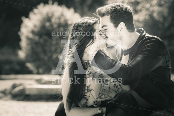 Young Couple Loving Outdoors In A Park. A Young Man And Young Wo Angelo Cordeschi