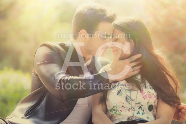 Young Couple Loving Outdoors In A Park. A Young Man And Young Wo Angelo Cordeschi