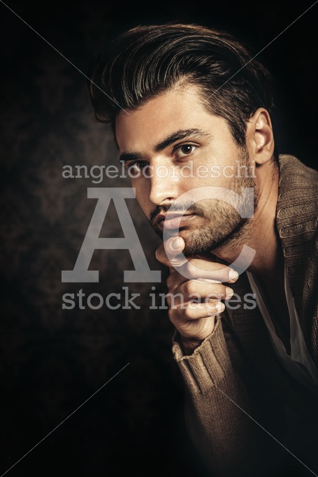 Young Handsome Man Portrait With Hand Under His Chin. In Studio, Angelo Cordeschi
